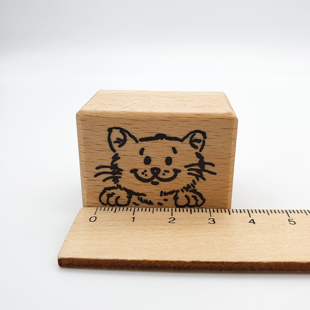 Stempel mit dem Motiv einer lächelnden Katze