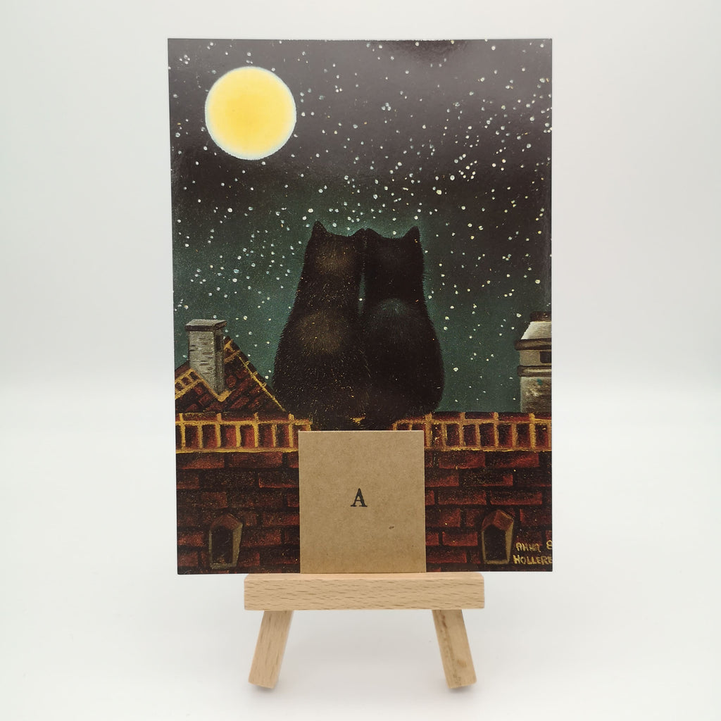 Postkarte mit zwei schwarzen Katzen, die den Sternenhimmel betrachten