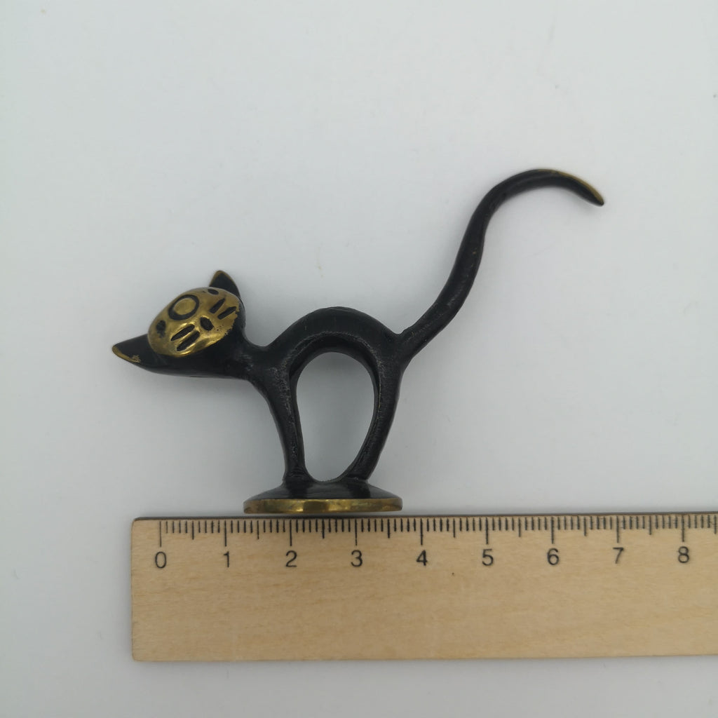 Gold-schwarzer Ringhalter in Form einer Katze mit Lineal