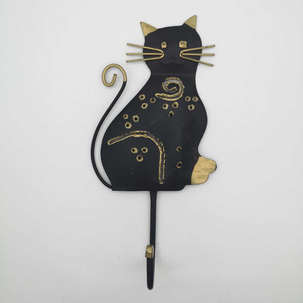 Wandhaken mit einer schwarz-goldenen Katze